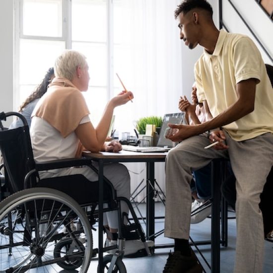 side-view-woman-wheelchair-work_23-2149546172